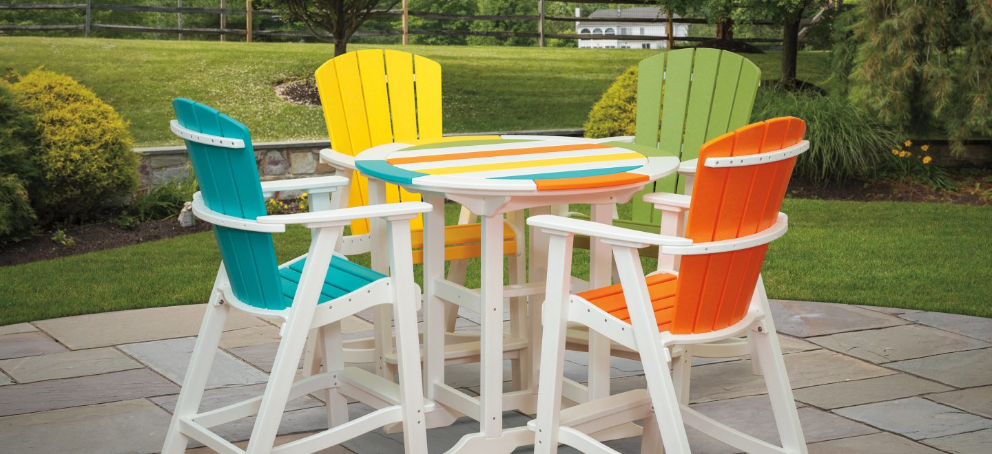 multi-colored polywood balcony chairs and round table